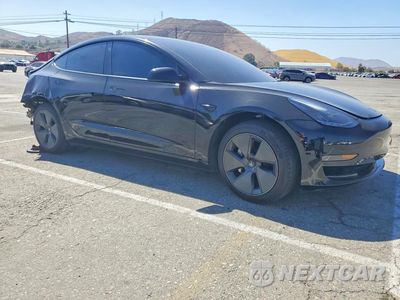 Czwarte zdjęcie samochodu z boku: 2023 TESLA MODEL 3 VIN:5YJ3E1EA1PF556951 - miniatura