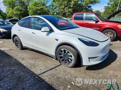 Czwarte zdjęcie samochodu z boku: 2023 TESLA MODEL Y VIN:7SAYGDEE4PA101225 - miniatura