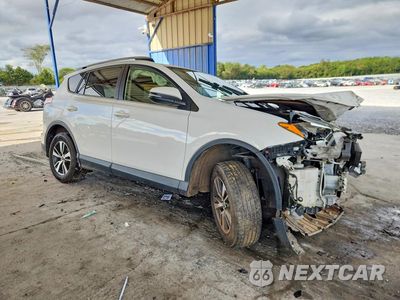 Czwarte zdjęcie samochodu z boku: 2018 TOYOTA RAV4 XLE VIN:JTMWFREV4JJ170651 - miniatura