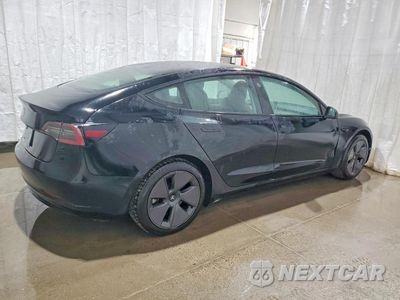 Trzecie zdjęcie samochodu z tyłu: 2022 TESLA MODEL 3 VIN:5YJ3E1EA9NF371169 - miniatura