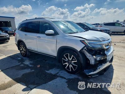 Czwarte zdjęcie samochodu z boku: 2020 HONDA PILOT TOURING VIN:5FNYF5H69LB008031 - miniatura