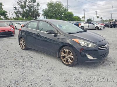 Czwarte zdjęcie samochodu z boku: 2013 HYUNDAI ELANTRA GT BASE VIN:KMHD35LE5DU125387 - miniatura