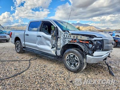 Czwarte zdjęcie samochodu z boku: 2022 FORD F150 LIGHTNING PRO VIN:1FTVW1EL3NWG05602 - miniatura