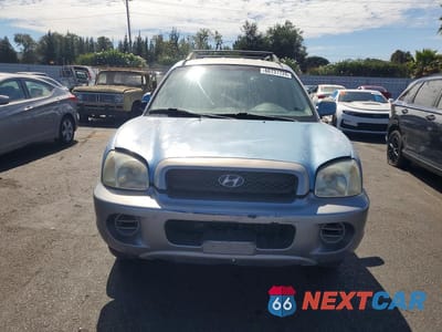 Piąte zdjęcie samochodu w środku: 2004 HYUNDAI SANTA FE BASE VIN:KM8SB12B74U709624 - miniatura