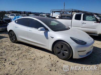 Czwarte zdjęcie samochodu z boku: 2018 TESLA MODEL 3 VIN:5YJ3E1EB2JF115636 - miniatura