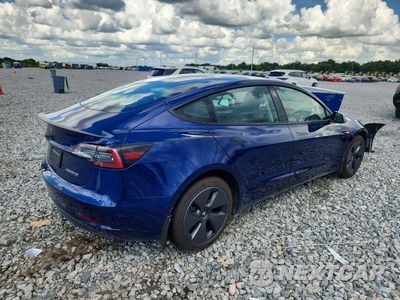Trzecie zdjęcie samochodu z tyłu: 2023 TESLA MODEL 3 VIN:5YJ3E1EA1PF581154 - miniatura