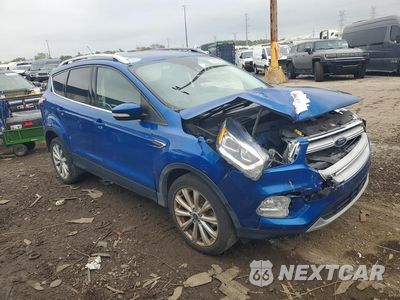 Czwarte zdjęcie samochodu z boku: 2017 FORD ESCAPE TITANIUM VIN:1FMCU0JD4HUE57350 - miniatura