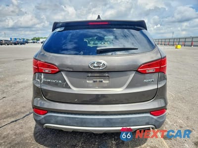 Zdjęcie 6 z 12 samochodu: 2013 HYUNDAI SANTA FE SPORT 2.4L VIN:5XYZT3LB6DG089649 - miniatura