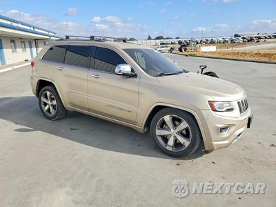 Czwarte zdjęcie samochodu z boku: 2014 JEEP GRAND CHEROKEE OVERLAND VIN:1C4RJFCG7EC237350 - miniatura