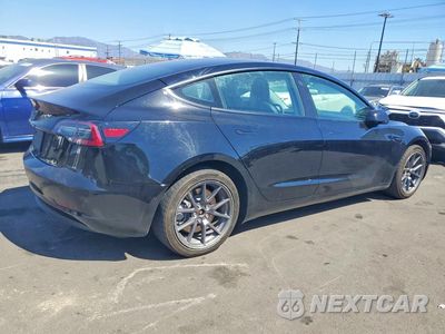 Trzecie zdjęcie samochodu z tyłu: 2022 TESLA MODEL 3 VIN:5YJ3E1EA1NF189451 - miniatura