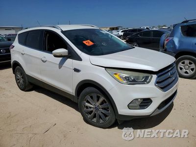 Czwarte zdjęcie samochodu z boku: 2017 FORD ESCAPE TITANIUM VIN:1FMCU9JD0HUD84692 - miniatura