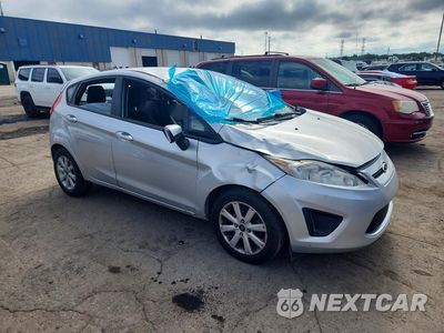Czwarte zdjęcie samochodu z boku: 2011 FORD FIESTA SE VIN:3FADP4EJ3BM116367 - miniatura