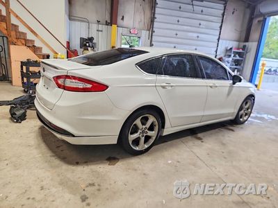 Trzecie zdjęcie samochodu z tyłu: 2016 FORD FUSION S VIN:3FA6P0G72GR221284 - miniatura