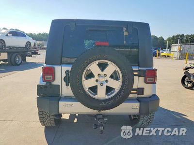 Zdjęcie 6 z 13 samochodu: 2010 JEEP WRANGLER UNLIMITED SAHARA VIN:1J4BA5H10AL123470 - miniatura