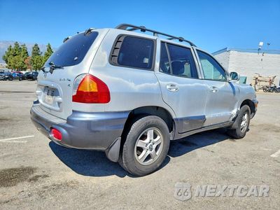 Trzecie zdjęcie samochodu z tyłu: 2003 HYUNDAI SANTA FE GLS VIN:KM8SC13D13U431511 - miniatura