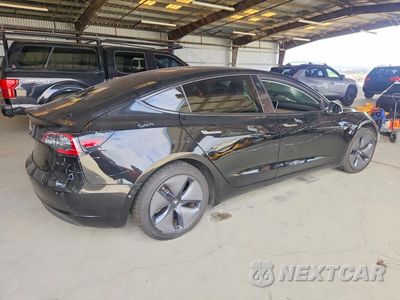 Trzecie zdjęcie samochodu z tyłu: 2018 TESLA MODEL 3 VIN:5YJ3E1EA9JF036102 - miniatura