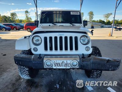 Piąte zdjęcie samochodu w środku: 2017 JEEP WRANGLER UNLIMITED SAHARA VIN:1C4BJWEG0HL573411 - miniatura