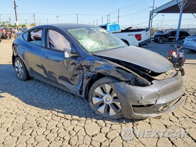 Czwarte zdjęcie samochodu z boku: 2023 TESLA MODEL Y VIN:7SAYGDEE4PA207920 - miniatura