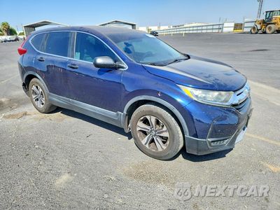 Czwarte zdjęcie samochodu z boku: 2017 HONDA CR-V LX VIN:7FARW5H37HE013878 - miniatura