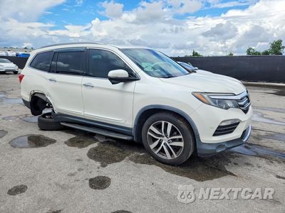 Czwarte zdjęcie samochodu z boku: 2018 HONDA PILOT TOURING VIN:5FNYF6H97JB019915 - miniatura