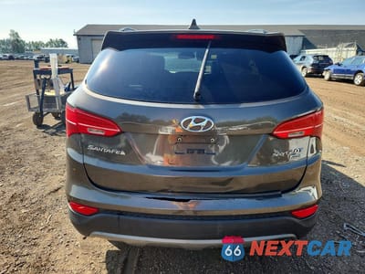 Zdjęcie 6 z 13 samochodu: 2014 HYUNDAI SANTA FE SPORT 2.0T VIN:5XYZWDLA4EG212225 - miniatura
