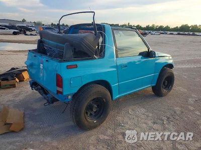 Trzecie zdjęcie samochodu z tyłu: 1992 CHEVROLET TRACKER VIN:2CNBE18U0N6916856 - miniatura