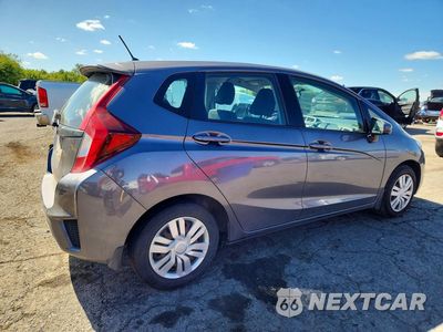 Trzecie zdjęcie samochodu z tyłu: 2015 HONDA FIT LX VIN:3HGGK5H5XFM767254 - miniatura