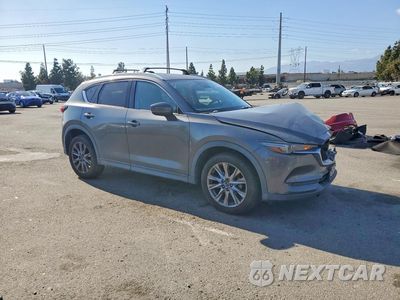 Czwarte zdjęcie samochodu z boku: 2019 MAZDA CX-5 GRAND TOURING VIN:JM3KFADM5K1504106 - miniatura