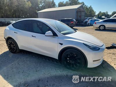 Czwarte zdjęcie samochodu z boku: 2023 TESLA MODEL Y VIN:7SAYGDEE1PA118337 - miniatura