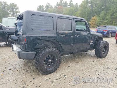 Trzecie zdjęcie samochodu z tyłu: 2014 JEEP WRANGLER UNLIMITED SAHARA VIN:1C4HJWEG1EL310141 - miniatura