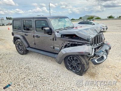 Czwarte zdjęcie samochodu z boku: 2022 JEEP WRANGLER UNLIMITED SAHARA 4XE VIN:1C4JJXP66NW227864 - miniatura