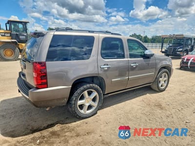 Trzecie zdjęcie samochodu z tyłu: 2012 CHEVROLET TAHOE C1500 LTZ VIN:1GNSCCE01CR295384 - miniatura