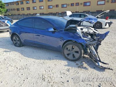 Czwarte zdjęcie samochodu z boku: 2023 TESLA MODEL 3 VIN:5YJ3E1EA3PF573038 - miniatura