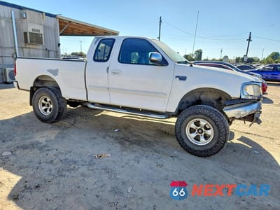 Czwarte zdjęcie samochodu z boku: 2000 FORD F150 VIN:1FTRX17L0YKA27272 - miniatura