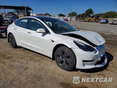 Czwarte zdjęcie samochodu z boku: 2023 TESLA MODEL 3 VIN:5YJ3E1EA1PF554178 - miniatura