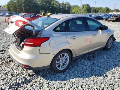 Trzecie zdjęcie samochodu z tyłu: 2017 FORD FOCUS SE VIN:1FADP3F29HL221183 - miniatura