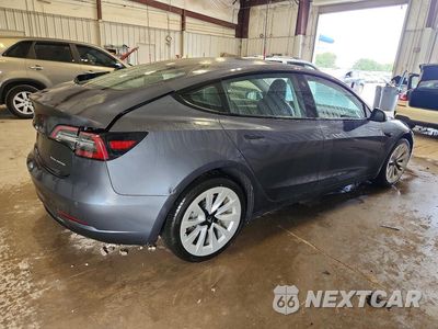 Trzecie zdjęcie samochodu z tyłu: 2022 TESLA MODEL 3 VIN:5YJ3E1EB3NF247066 - miniatura