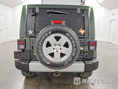 Zdjęcie 6 z 13 samochodu: 2011 JEEP WRANGLER UNLIMITED SAHARA VIN:1J4BA5H16BL575604 - miniatura
