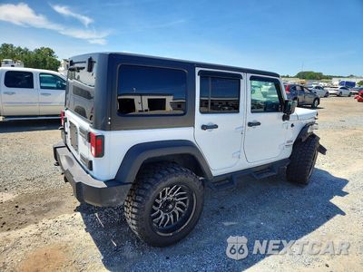 Trzecie zdjęcie samochodu z tyłu: 2016 JEEP WRANGLER UNLIMITED SPORT VIN:1C4HJWDG2GL170041 - miniatura