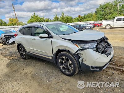 Czwarte zdjęcie samochodu z boku: 2017 HONDA CR-V TOURING VIN:2HKRW2H92HH619525 - miniatura