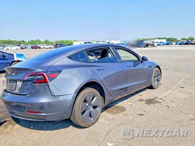 Trzecie zdjęcie samochodu z tyłu: 2023 TESLA MODEL 3 VIN:5YJ3E1EA5PF648998 - miniatura