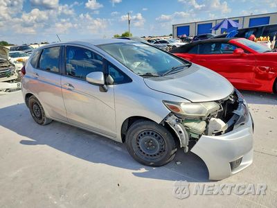 Czwarte zdjęcie samochodu z boku: 2016 HONDA FIT LX VIN:JHMGK5H54GX015526 - miniatura