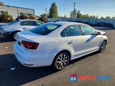 Trzecie zdjęcie samochodu z tyłu: 2017 VOLKSWAGEN JETTA SE VIN:3VWDB7AJ1HM223830 - miniatura