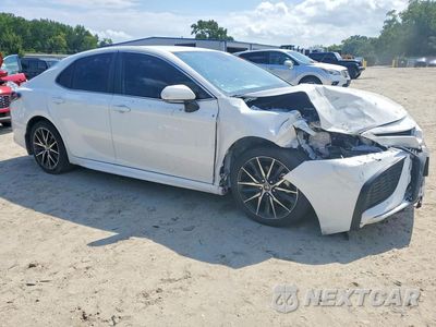 Czwarte zdjęcie samochodu z boku: 2024 TOYOTA CAMRY HYBRID SE VIN:4T1G31AK7RU075890 - miniatura