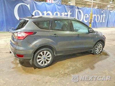 Trzecie zdjęcie samochodu z tyłu: 2018 FORD ESCAPE TITANIUM VIN:1FMCU9J99JUA79774 - miniatura
