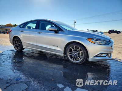Czwarte zdjęcie samochodu z boku: 2018 FORD FUSION SE HYBRID VIN:3FA6P0LU7JR197230 - miniatura