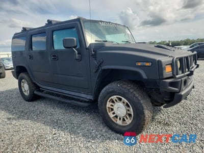 Czwarte zdjęcie samochodu z boku: 2005 HUMMER H2 VIN:5GRGN23U55H103612 - miniatura