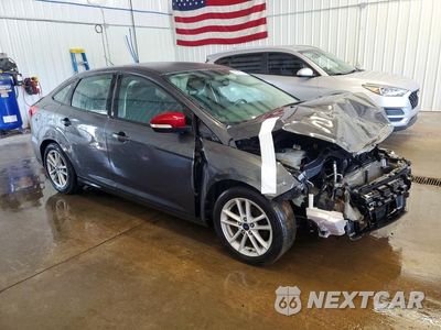 Czwarte zdjęcie samochodu z boku: 2017 FORD FOCUS SE VIN:1FADP3F24HL218952 - miniatura