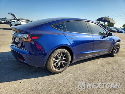 Trzecie zdjęcie samochodu z tyłu: 2023 TESLA MODEL 3 VIN:5YJ3E1EA5PF613118 - miniatura