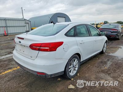 Trzecie zdjęcie samochodu z tyłu: 2017 FORD FOCUS SE VIN:1FADP3F29HL229994 - miniatura